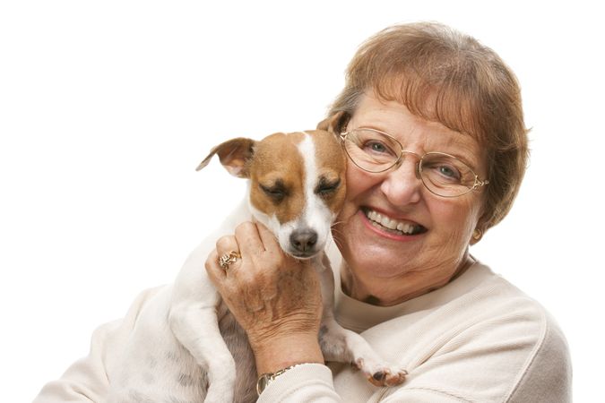 Happy Attractive Older Woman with Puppy.