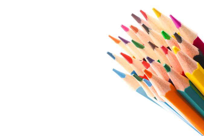 Multicolored pencils isolated on blank background, closeup