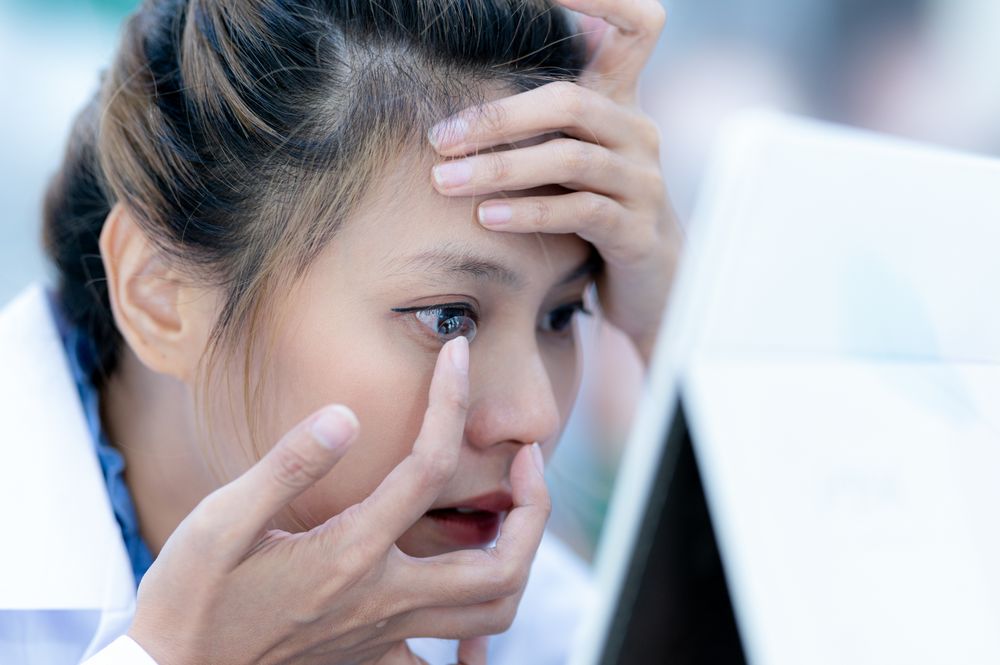 Young woman wearing contact lenses.
