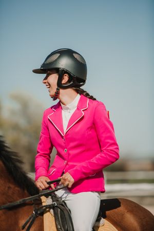 Teen girl riding horse