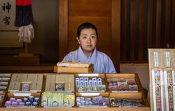 Japan - May, 10 2013: Asian woman selling souvenirs