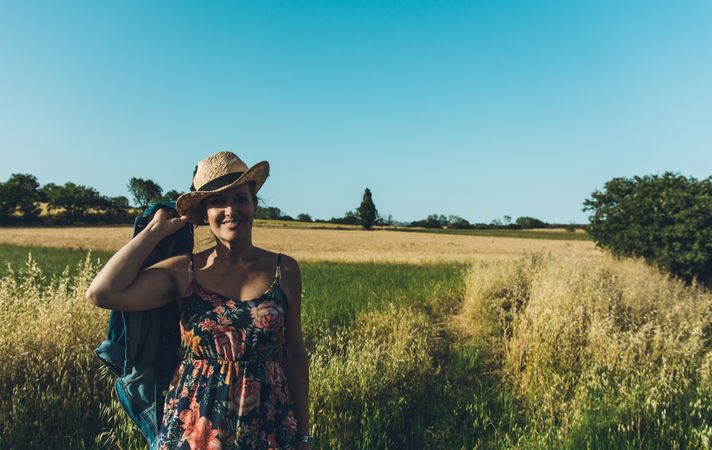 Female farmer with hat looking at camera
