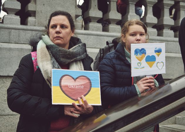 London, England, United Kingdom - March 5 2022: Two female holding heart sign with Ukrainian flag