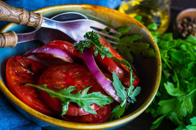 Fresh tomato salad in colorful bowl