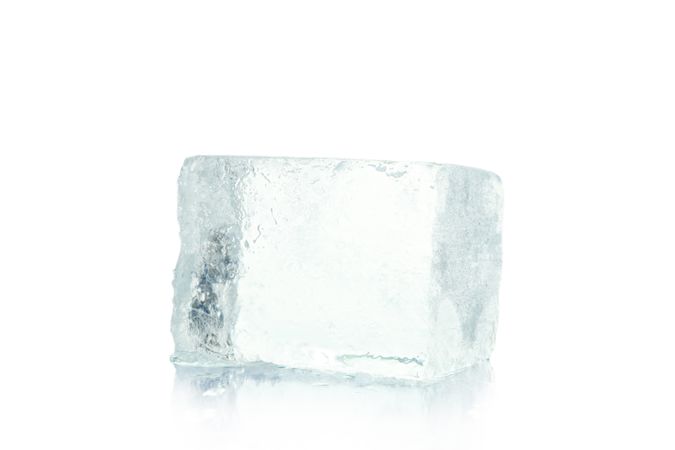 Ice cube on plain background