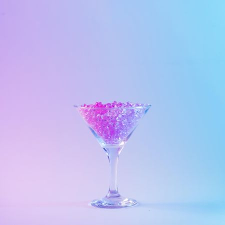 Martini glass with pink glitter in vibrant bold gradient holographic colors