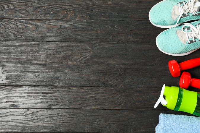 Flat lay composition with healthy lifestyle accessories on wooden background