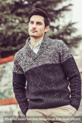 Man lost in thought outside in woolen sweater 5l1Q74