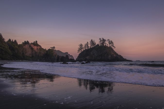 Sunset or sunrise over low tide at a quiet beach