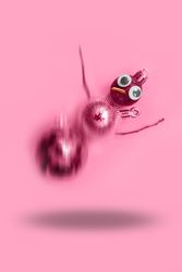 Falling pink snowman made out of Christmas decorations