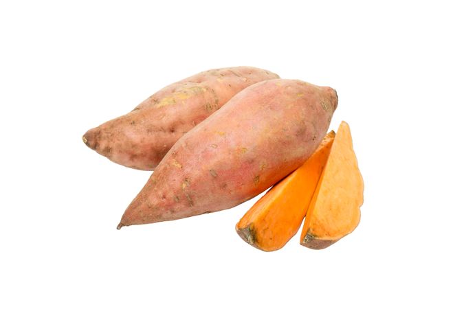 Sweet potato roots, isolated on blank background