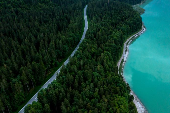 Aerial image with winding road in Bavarian Alps on Sylventein lakeshore, Germany