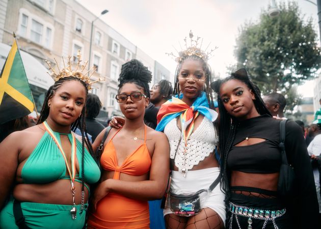 London, England, United Kingdom - August 28, 2022: Dressed up friends at Notting Hill Carniavl