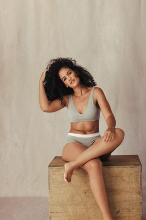 Black female model posing confidently in her natural body