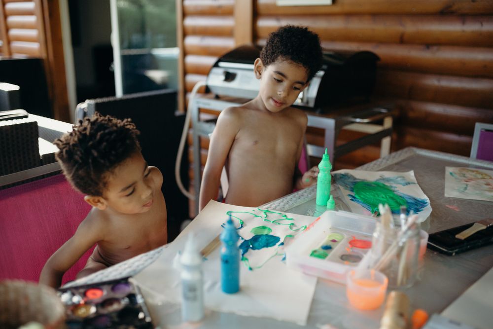 Black kids painting together