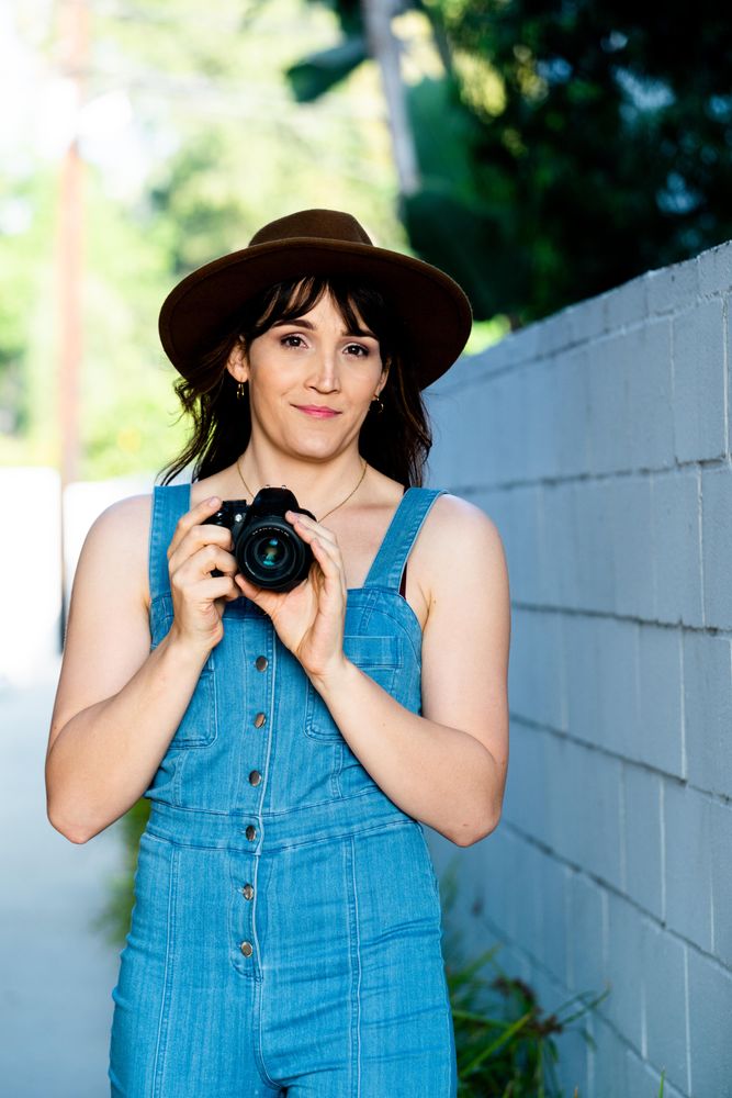 Transgender woman holding camera
