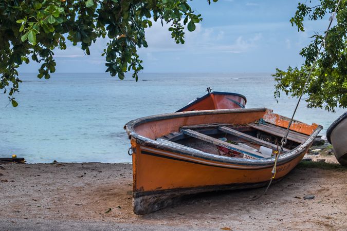 Boat on the sand in front of beach