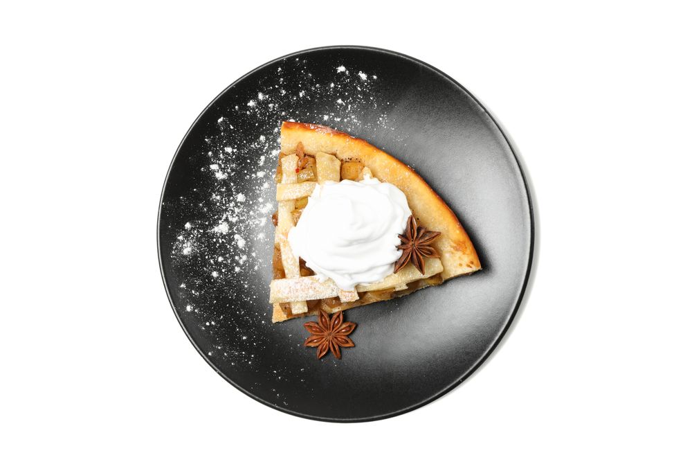 Plate with piece of apple pie isolated on plain background