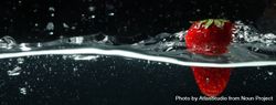 Side view banner of water splashing on dark background with strawberry 5aaXG5