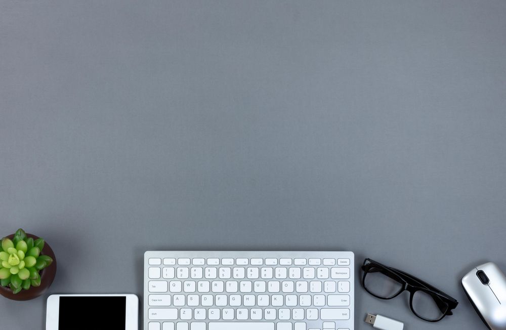 Gray desktop with bottom border at work technology concept