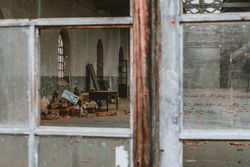 Old broken construction with broken windows and furniture