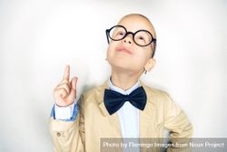 Blond boy pointing up in glasses with bow tie 5nqPn0