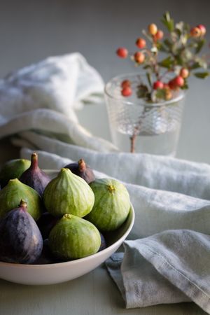 Plate of fresh ripe figs on kitchen table