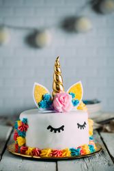 Cute unicorn cake with painted closed eyes