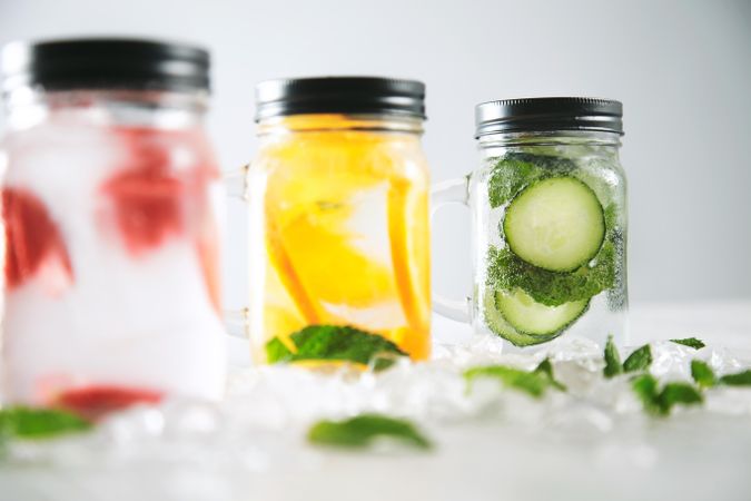 Close up of glass jars of different flavors of infused water