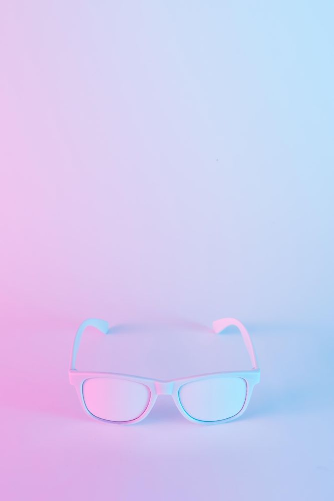 Sunglasses in vibrant bold gradient purple and blue holographic colors