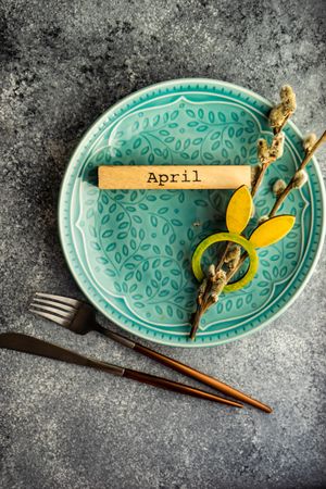 Easter card concept of rabbit napkin ring on table setting