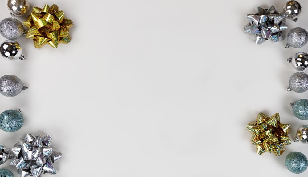 Shiny bows and decorations on background in flat lay format