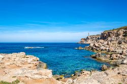 Cala Portinax bay with beautiful azure blue sea water