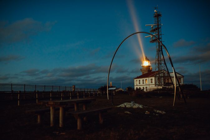 Road and lighthouse in evening