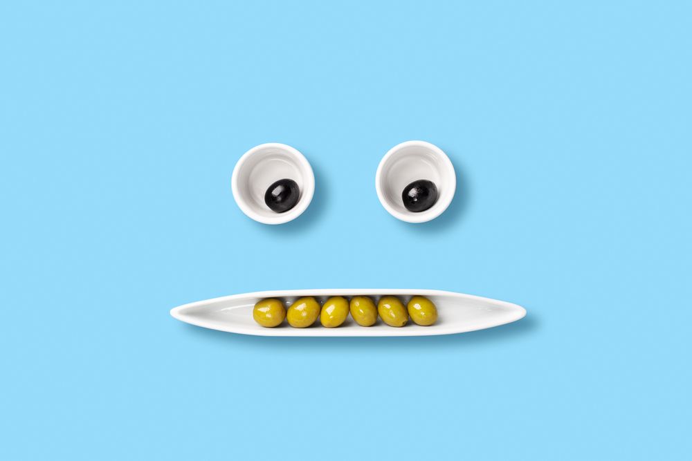 Olives on tray forming a face