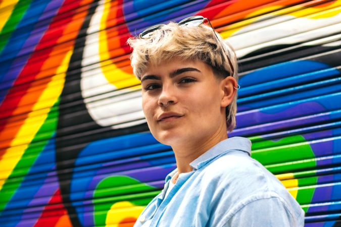 stylish young woman portrait on a rainbow background
