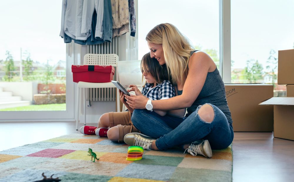 Mother and son playing the tablet