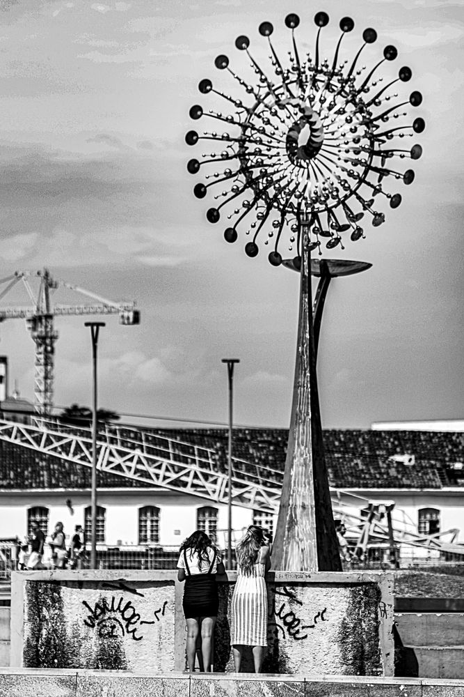 Grayscale photo of people in amusement park