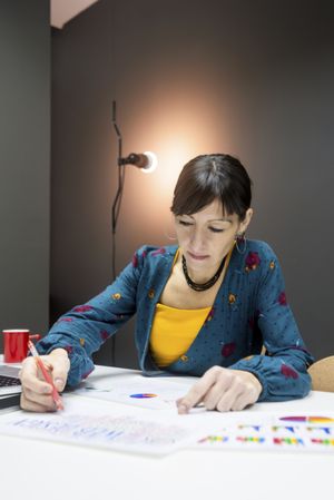Woman working with charts in office