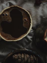 Close up of coffee cup on bed