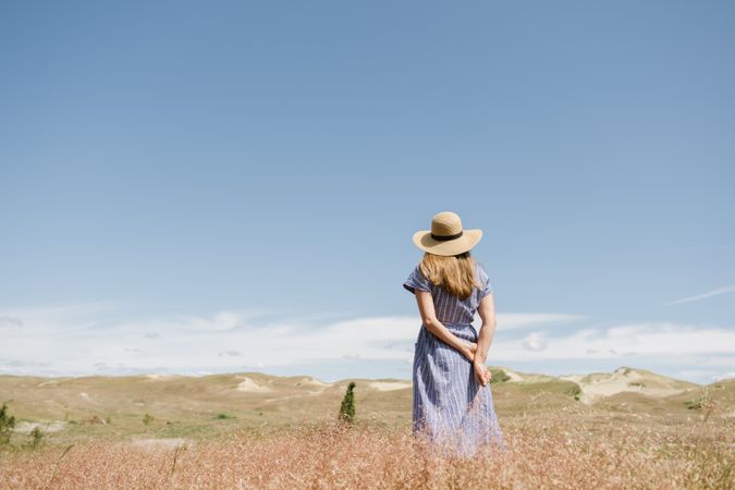 Young woman gathering dried spikes