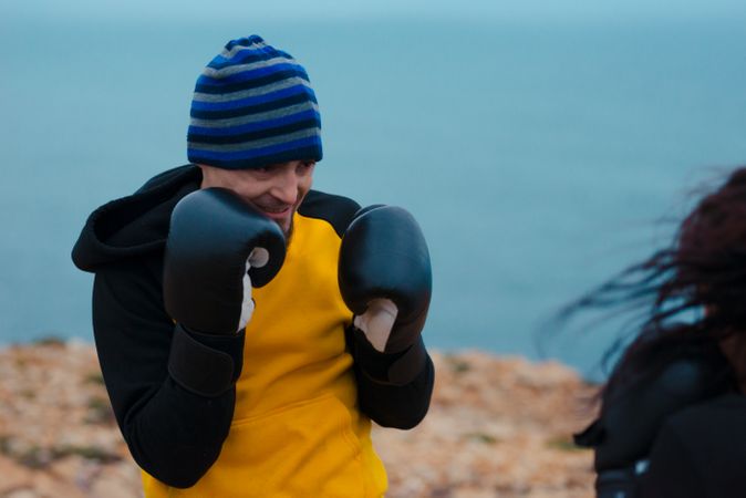 Boxers exercising on cliff