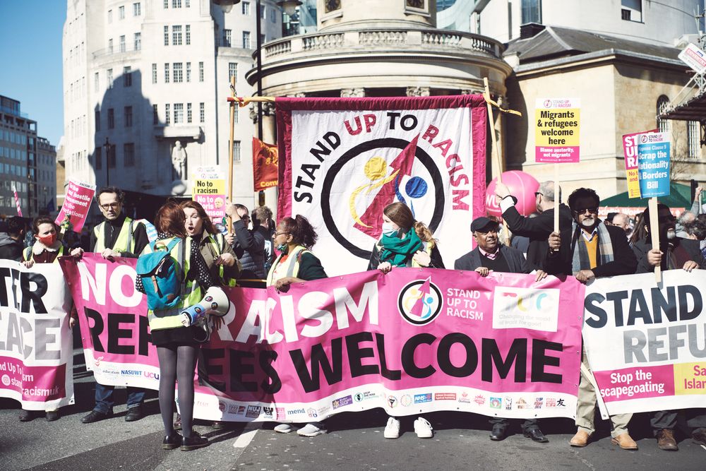 London, England, United Kingdom - March 19 2022: Large group with protest banners in London