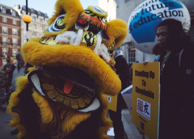 London, England, United Kingdom - March 19 2022: Yellow Chinese dragon at anti-racism rally
