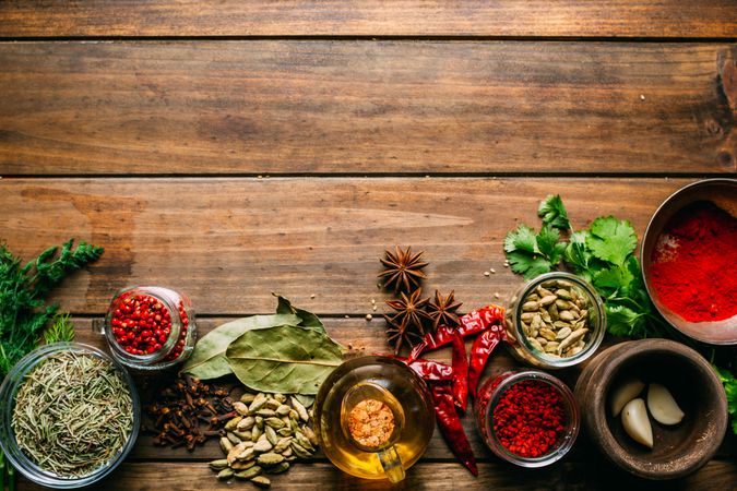 Spices and oil on table