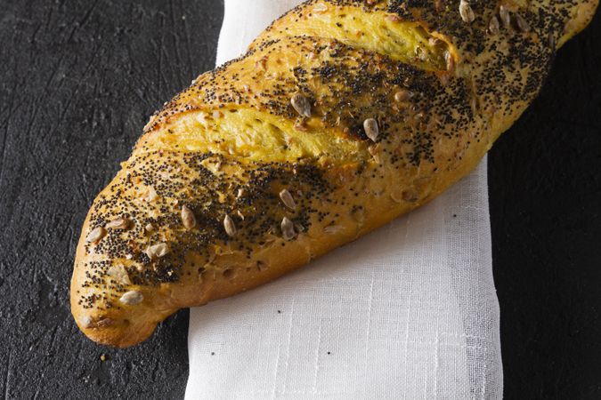 Loaf of bread with grains and poppy seeds