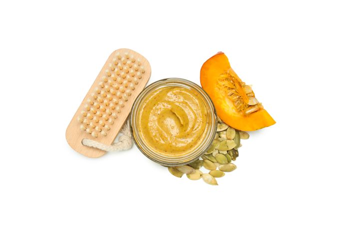Concept of different cosmetic products, Pumpkin cosmetics, isolated on light background