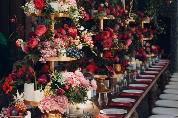 Red fruits and flowers setup on table