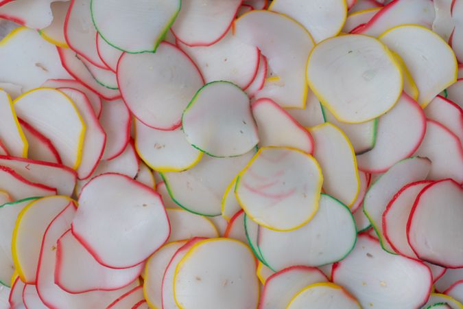 Thinly sliced, dried raw crackers ready to be fried