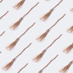 Broomstick pattern on light background